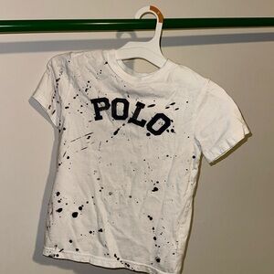 Short sleeved tee with navy blue paint splatter design on the front.